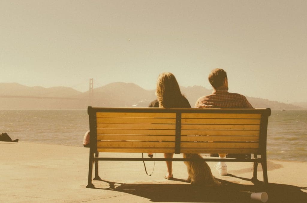 Picture of couple looking out over water. How to thrive during a recession by Runey & Associates Wealth Management.